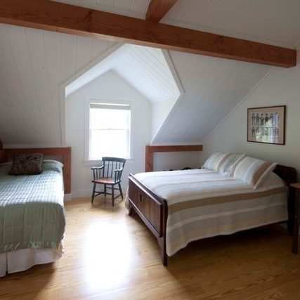 post and beam vacation cottage guest bedroom