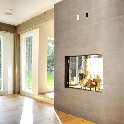 Clean modern fireplace in Contemporary Barn Home